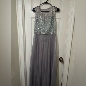 This is a long, gray, shimmery dress.